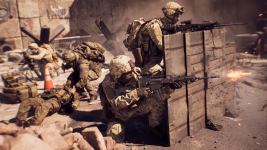 Das Bild zeigt eine lebhafte Kampfszene aus einem militärischen Setting. Mehrere Soldaten sind in taktischen Positionen dargestellt, während sie sich hinter einer Schutzbarriere verstecken. Einer der Soldaten ist kniend, zielt mit einem Sturmgewehr, während hinter ihm weitere Kameraden aktiv sind. Die Umgebung wirkt chaotisch und realistisch, mit Trümmern und Staub, die auf ein intensives Gefecht hindeuten. Der Fokus liegt auf der actiongeladenen Darstellung und der Darstellung der Soldaten, die in die Abläufe einer bewaffneten Auseinandersetzung verwickelt sind.