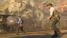 Das Bild zeigt eine actionreiche Szene aus Red Dead Redemption 2, in der zwei Charaktere mit Schusswaffen im Vordergrund zu sehen sind. Der linke Charakter trägt ein blaues Hemd und zielt mit einer Waffe, während der rechte Charakter in einem weißen Hemd steht und ebenfalls bereit ist, zu schießen. Im Hintergrund ist eine Dampflok zu sehen, die von einem Bahnhof umgeben ist, und die Szenerie vermittelt den typischen Wildwest-Charme des Spiels. Die Atmosphäre ist angespannt, was durch die Bewegung und die Waffen der Charaktere verstärkt wird. Das Bild zeigt eine actionreiche Szene aus Red Dead Redemption 2, in der zwei Charaktere mit Schusswaffen im Vordergrund zu sehen sind. Der linke Charakter trägt ein blaues Hemd und zielt mit einer Waffe, während der rechte Charakter in einem weißen Hemd steht und ebenfalls bereit ist, zu schießen. Im Hintergrund ist eine Dampflok zu sehen, die von einem Bahnhof umgeben ist, und die Szenerie vermittelt den typischen Wildwest-Charme des Spiels. Die Atmosphäre ist angespannt, was durch die Bewegung und die Waffen der Charaktere verstärkt wird.